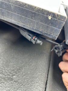Electrician carrying out solar panel repairs in Rowville, Victoria.